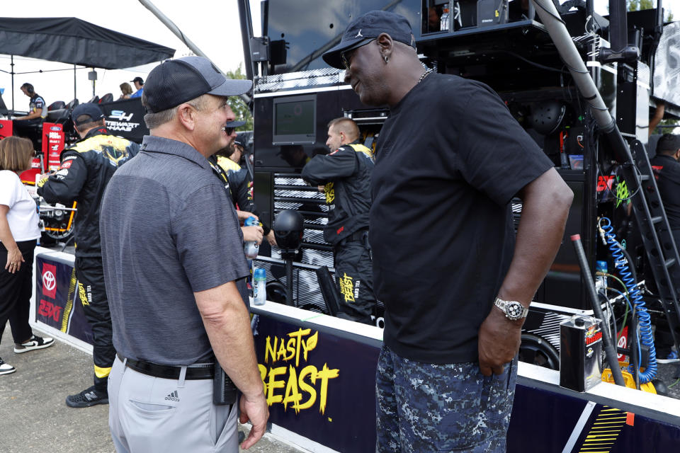 Bob Jenkins, owner of Front Row Motorsports and Co-Owner Michael Jordan, of 23XI Racing, talk before a NASCAR Cup Series auto race at Talladega Superspeedway, Sunday, Oct. 6, 2024, in Talladega, Ala. (AP Photo/ Butch Dill)