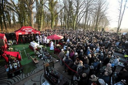 People take part in the funeral of the Polish driver Lukasz Urban, who was killed in the Berlin market attack, at the cemetery in Banie village near Szczecin, north-western Poland December 30, 2016. Agencja Gazeta/Cezary Aszkielowicz/via REUTERS