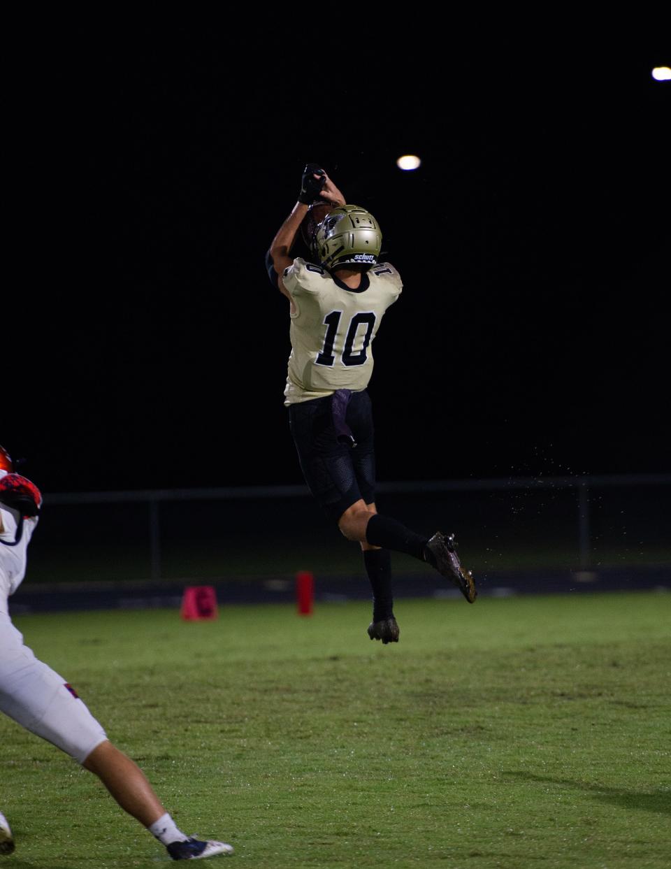 PHOTO BY KAT EDWARDS Gateway's Dylan Alif gets air to catch the ball during Friday's game against Lemon Bay