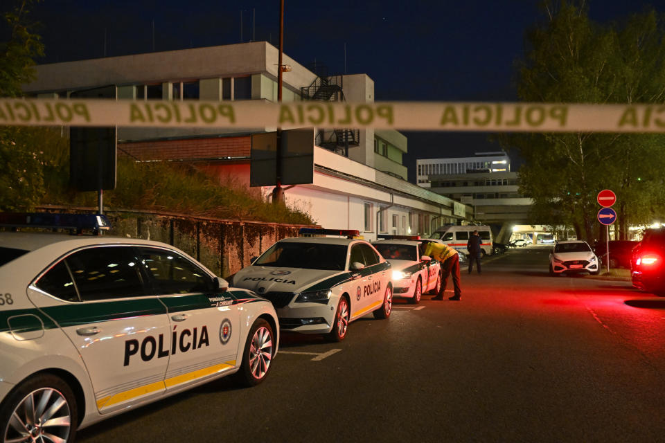 Police cars are parked outside the F. D. Roosevelt University Hospital, where Slovak Prime Minister Robert Fico, who was shot and injured, is treated in Banska Bystrica, central Slovakia, Wednesday, May 15, 2024. Slovak Prime Minister Robert Fico is in life-threatening condition after being wounded in a shooting after a political event Wednesday afternoon, according to his Facebook profile.(AP Photo/Denes Erdos)