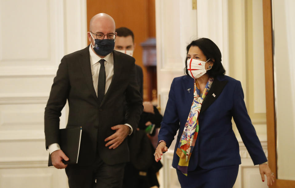 In this photo provided by the Georgian Presidential Press Office, Georgia's President Salome Zurabishvili, right, attends a meeting with European Council President Charles Michel in Tbilisi, Georgia, Monday, March 1, 2021 (Georgian Presidential Press Office via AP)
