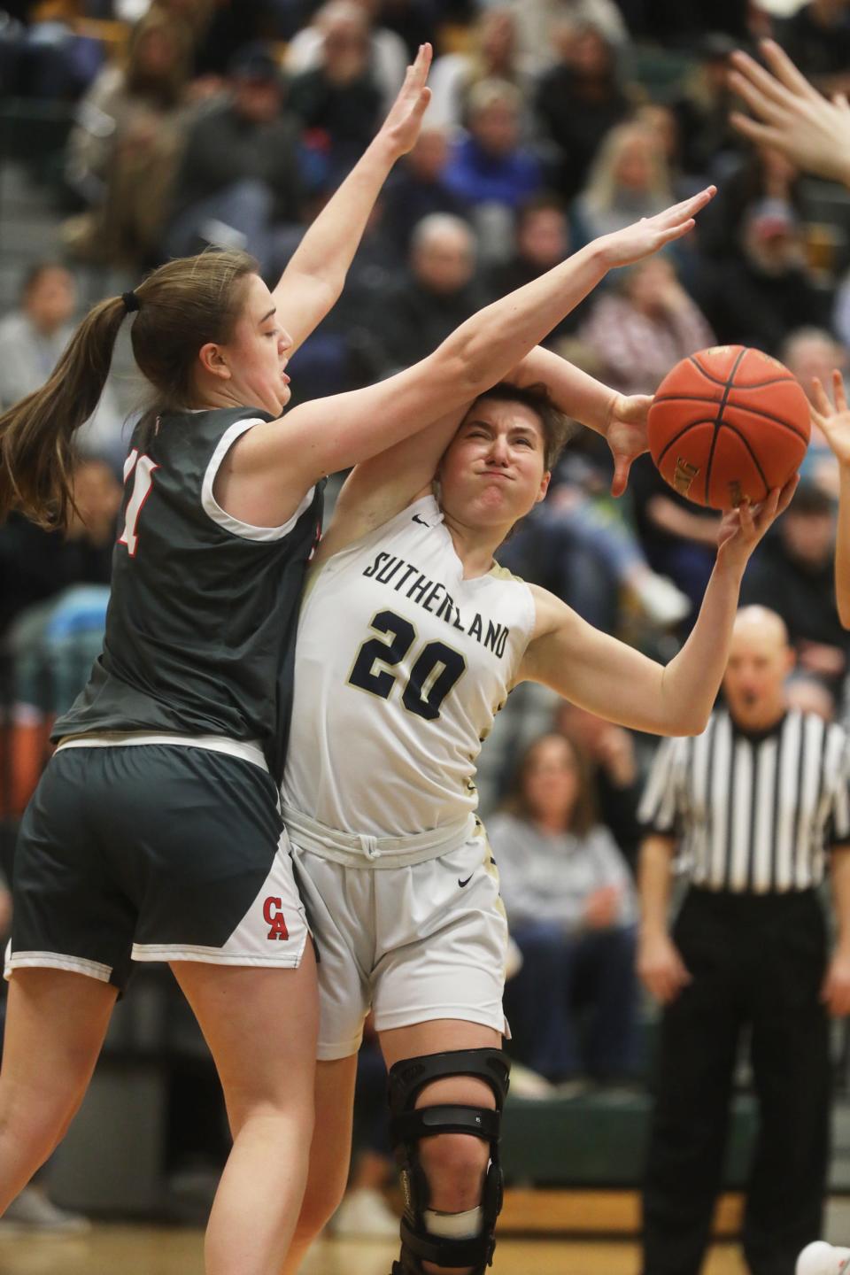 Pittsford Sutherland Ellie Bergin tries to get around Canandaigua Academy's Kyleigh Chapman to make a basket.