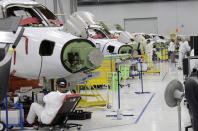 This July 30, 2019 shows the production area at the Honda Aircraft Co. headquarters in Greensboro, N.C. where the HondaJet Elite aircraft is manufactured. Nearly four years after delivering its first jet, Honda is facing decisions as the company better known for cars and lawnmowers considers whether to sink billions more into its decades-in-the-making aircraft division. (AP Photo/Gerry Broome)