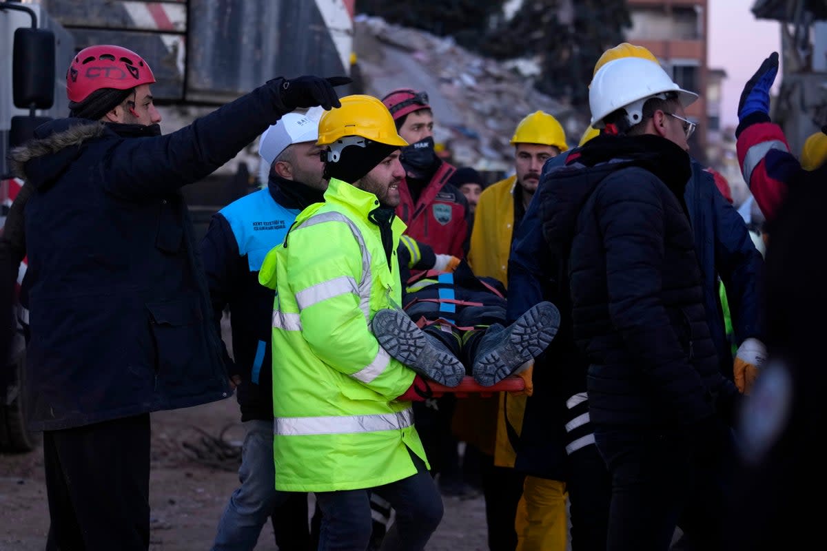 A rescue worker being taking out after had a fraction on his leg, in Ghaziantep (Copyright 2023 The Associated Press. All rights reserved)