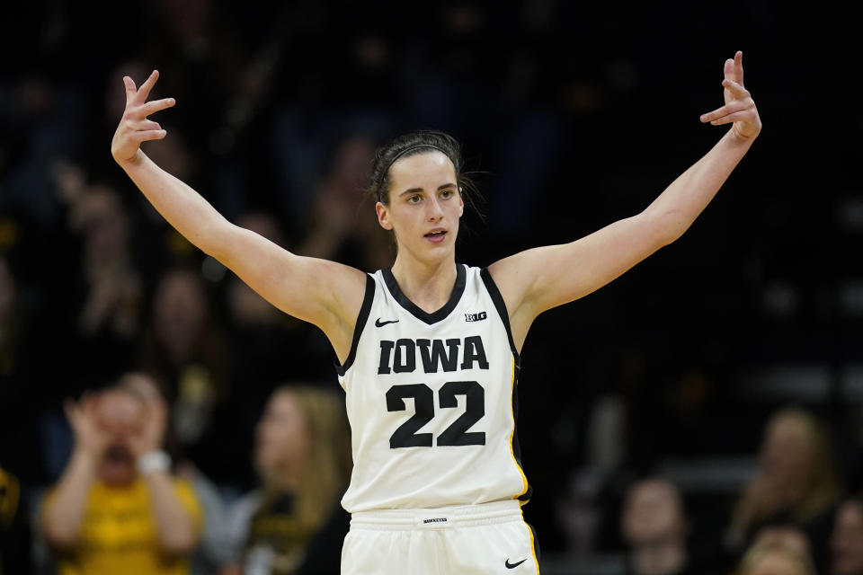 Iowa guard Caitlin Clark celebrates after making a 3-point basket during the second half of an NCAA college basketball game against Drake, Sunday, Nov. 19, 2023, in Iowa City, Iowa. Iowa won 113-90. (AP Photo/Charlie Neibergall)