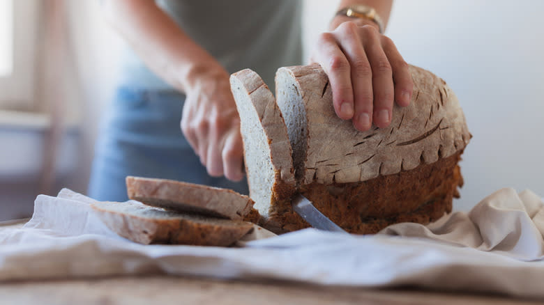 slicing loaf of bread