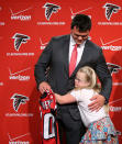 Atlanta Falcons first-round draft pick Jake Matthews, gets a hug from his younger sister Gwen, 10, during an NFL football news conference at the team's headquarters Friday, May 9, 2014, in Flowery Branch, Ga. Matthews, an offensive lineman from Texas A&M, was the selected 6th overall in Thursday's NFL draft. (AP Photo/Jason Getz)