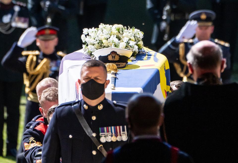 Pallbearers carry the coffin up the west steps of St George's Chapel during the funeral of Britain's Prince Philip, Duke of Edinburgh in Windsor Castle in Windsor, west of London, on April 17, 2021. - Philip, who was married to Queen Elizabeth II for 73 years, died on April 9 aged 99 just weeks after a month-long stay in hospital for treatment to a heart condition and an infection. (Photo by Danny Lawson / POOL / AFP) (Photo by DANNY LAWSON/POOL/AFP via Getty Images)