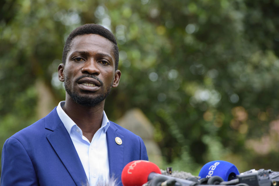 The National Unity platform presidential candidate Bobi Wine addresses the media at his home in Magere, Uganda, Friday, Jan. 15, 2021. Uganda’s electoral commission says President Yoweri Museveni leads in Thursday’s election with results in from 29% of polling stations. He has 63% of ballots while top opposition candidate Bobi Wine has 28%. Wine, a popular singer-turned-lawmaker half the president’s age, alleges that the vote in the East African country was rigged. (AP Photo/Nicholas Bamulanzeki)