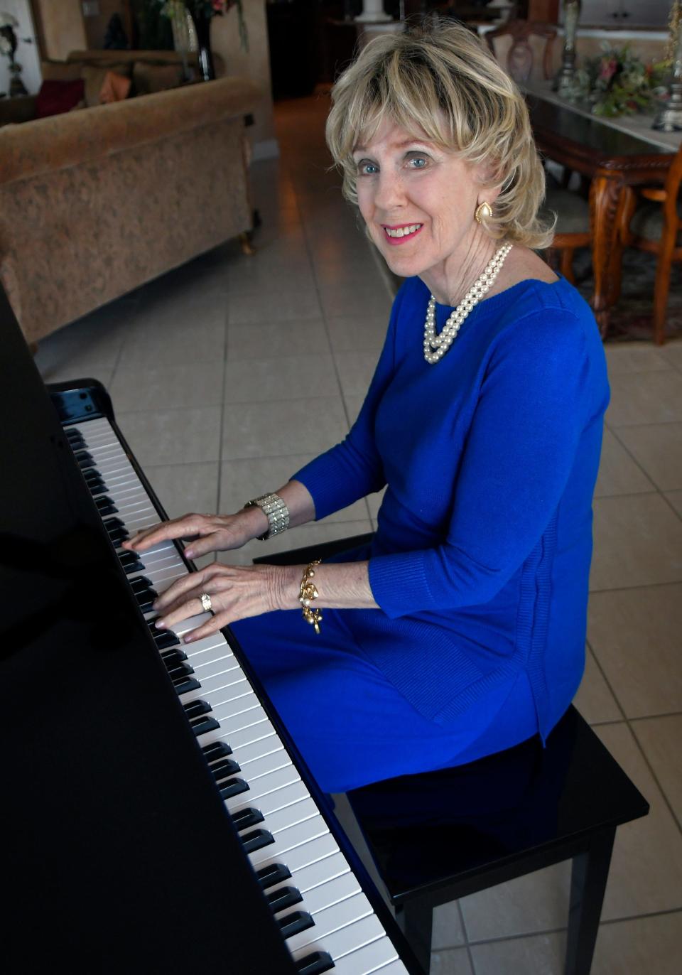 Susie Wasdin playing the piano at home in Cocoa.