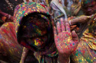 <p>Widows daubed in colours dance as they take part in Holi celebrations in the town of Vrindavan in the northern state of Uttar Pradesh, India, Feb. 27, 2018. (Photo: Adnan Abidi/Reuters) </p>