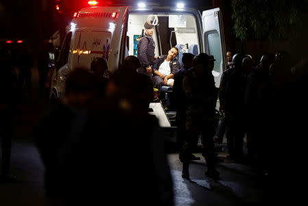 A member of a Jordanian security personnel receives treatment after sustaining injury during a protest in Amman, Jordan, June 3, 2018. REUTERS/Muhammad Hamed