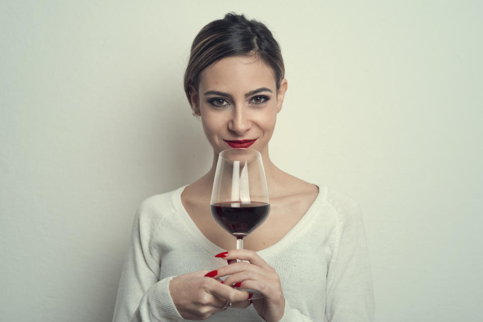 Portrait of Young Woman Holding Wineglass