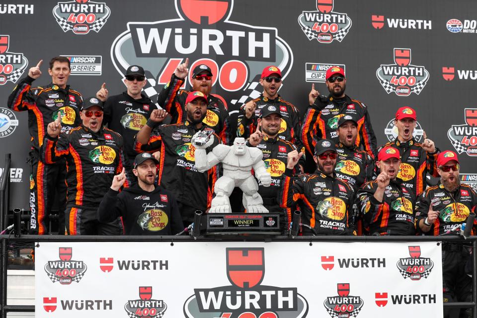 Martin Truex Jr. (bottom row, center) celebrates with his No. 19 Joe Gibbs Racing team after winning the Wurth 400 at Dover Motor Speedway on May 1, 2023.