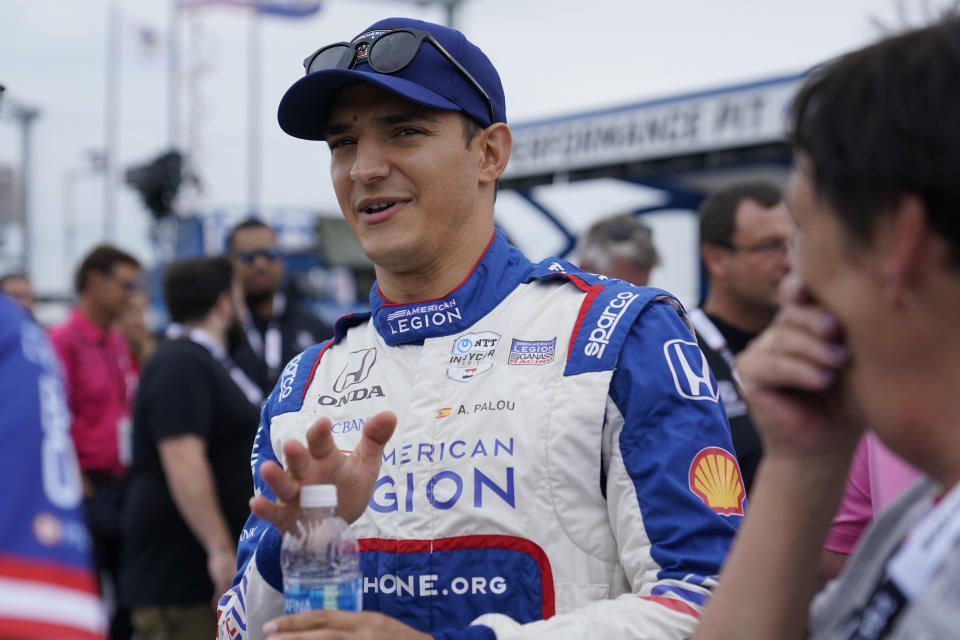 Alex Palou prepares before the start of an IndyCar auto race at World Wide Technology Raceway, Sunday, Aug. 27, 2023, in Madison, Ill. (AP Photo/Jeff Roberson)