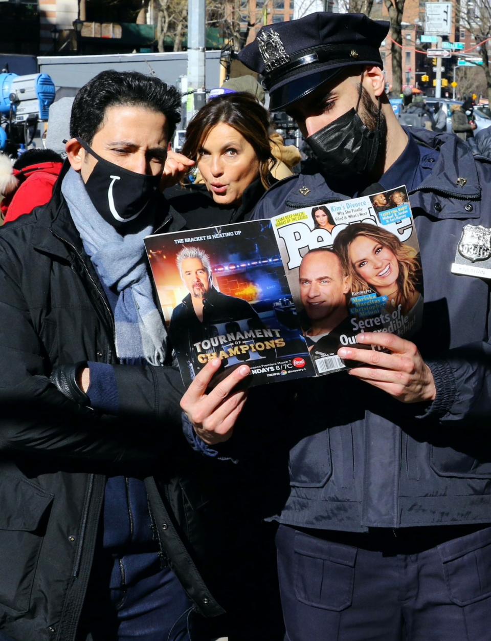 <p>Mariska Hargitay checks out her and Christopher Meloni's cover issue of PEOPLE while filming <em>Law & Order: Special Victims Unit </em>on Tuesday in N.Y.C. </p>