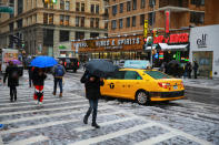 <p>Pedestrians walk along Broadway during snowstorm in New York City on March 7, 2018. (Photo: Gordon Donovan/Yahoo News) </p>