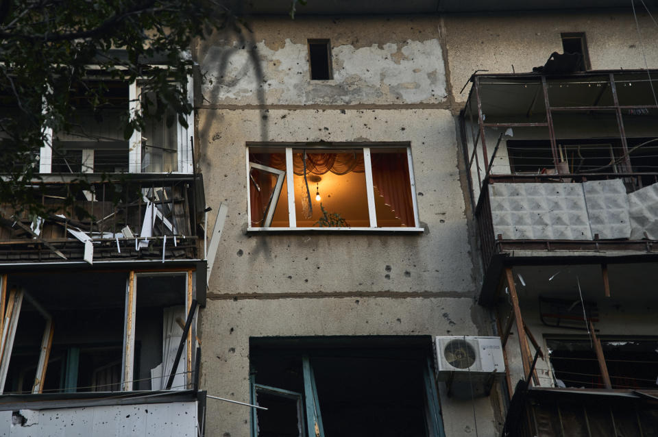 A view of a damaged building after a rocket attack early Wednesday morning, in Kramatorsk, eastern Ukraine, Wednesday, Aug. 31, 2022. (AP Photo/Kostiantyn Liberov)