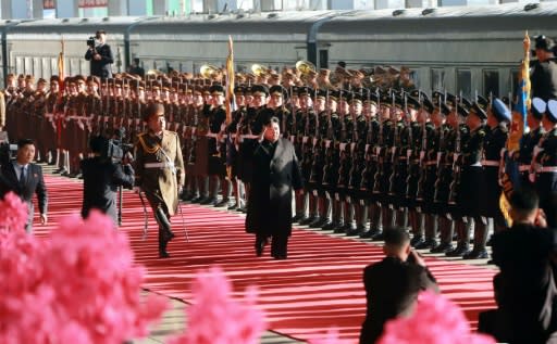 Kim set off on the long journey from Pyongyang on Saturday, with a military honour guard seeing him off
