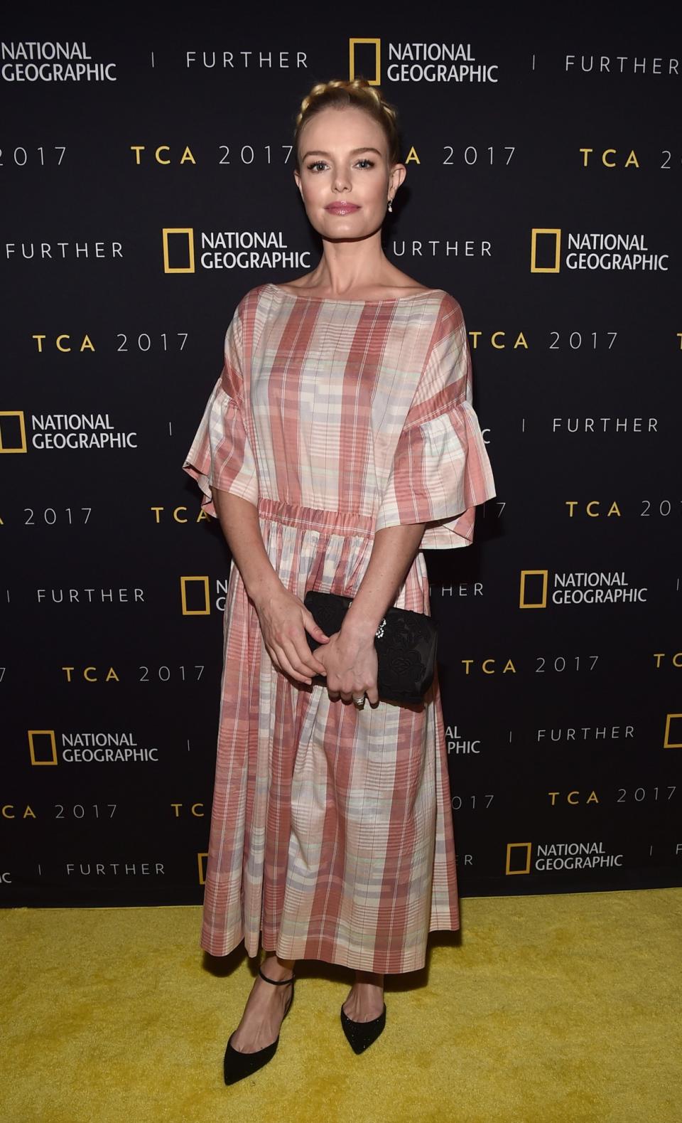 <p>The style icon didn’t disappoint in a summery checked Ulla Johnson dress and a milkmaid braid in her hair.<br><em>[Photo: Getty]</em> </p>