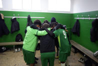 Players of the football club AS Bondy, where Kylian Mbappe played as a kid, stay together prior to a match in the Leo Lagrange stadium in Bondy, east of Paris, Saturday, Dec. 17, 2022. On the football fields where Kylian Mbappe hones the feints, dribbles and shots that all of France hopes to see in Sunday's World Cup final against Argentine, the next generation of French kids with big dreams is already hard at work to follow in the superstar's footsteps. (AP Photo/Thibault Camus)