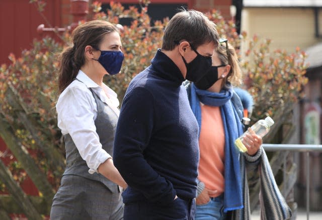 Actor Tom Cruise walks to the set of his latest project, which is filming in the sidings of the railway station in the village of Levisham in the North York Moors