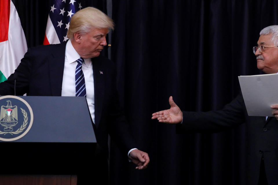 <p>Palestinian President Mahmoud Abbas extends his hand to President Donald Trump during their remarks after their meeting at the Presidential Palace in the West Bank city of Bethlehem May 23, 2017. (Photo: Jonathan Ernst/Reuters) </p>