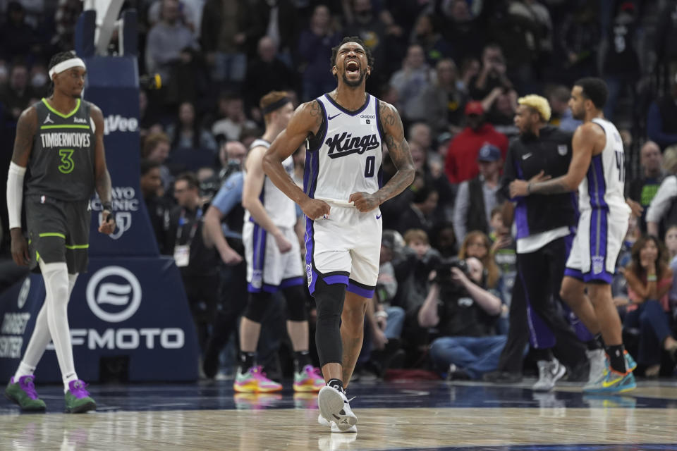 Sacramento Kings guard Malik Monk (0) celebrates the team's overtime win against the Minnesota Timberwolves in an NBA basketball game Friday, March 1, 2024, in Minneapolis. (AP Photo/Abbie Parr)