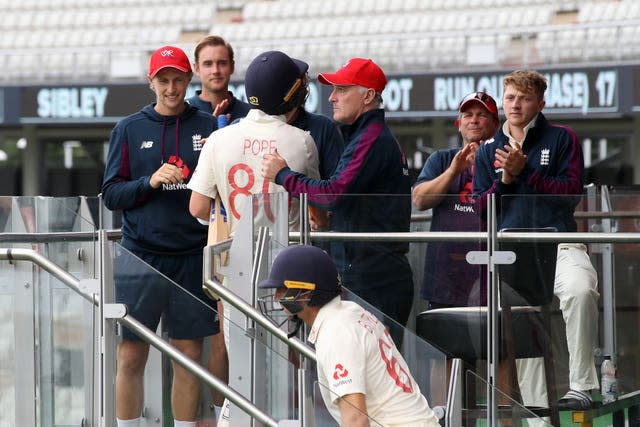 Ollie Pope is congratulated by Graham Thorpe after day one of a Test match against West Indies in July 2020