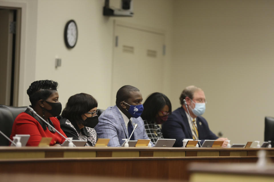 Several African American lawmakers listen as a House subcommittee hears testimony about a bill to define hate crimes in South Carolina on Tuesday, March 9, 2021, in Columbia, S.C. Forty-seven other states have a hate crimes bill. (AP Photo/Jeffrey Collins)