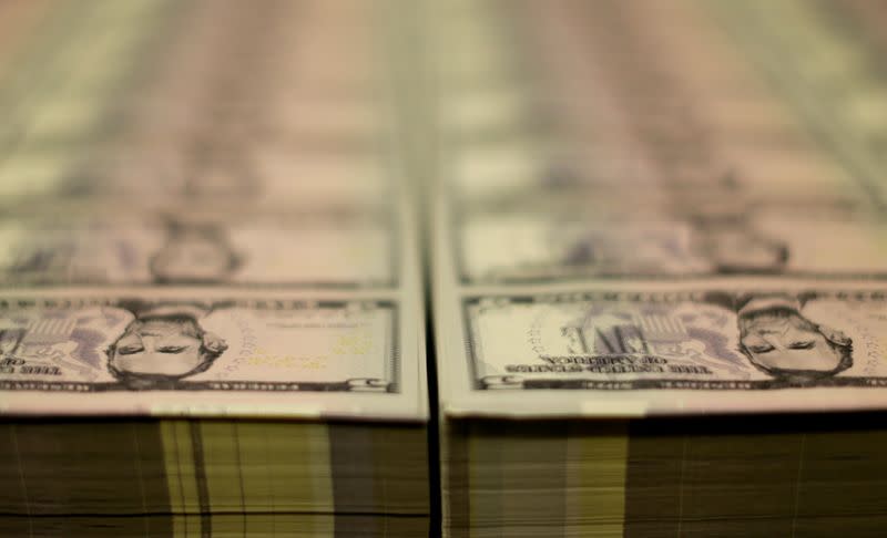FILE PHOTO: Stacks of Lincoln five dollar bill are seen at the Bureau of Engraving and Printing in Washington
