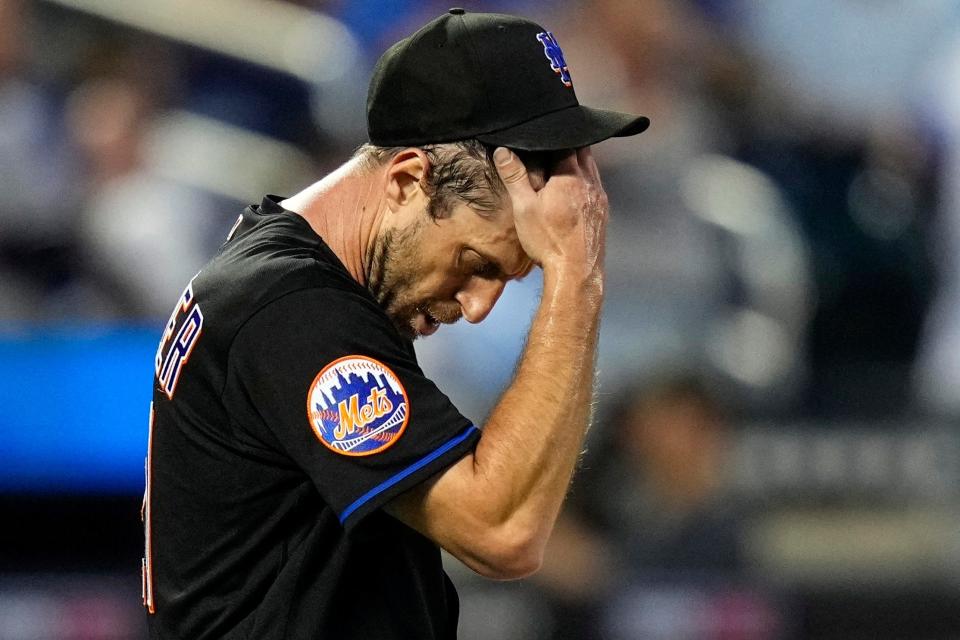 New York Mets starting pitcher Max Scherzer reacts after New York Yankees' Jake Bauers hit an RBI single during the fourth inning of a baseball game Tuesday, June 13, 2023, in New York.