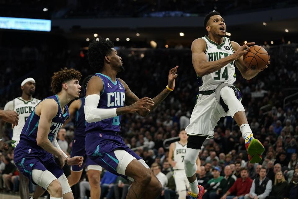 Milwaukee Bucks' Giannis Antetokounmpo shoots during the second half of an NBA basketball game against the Charlotte Hornets Wednesday, Dec. 1, 2021, in Milwaukee. The Bucks won 127-125. (AP Photo/Morry Gash)