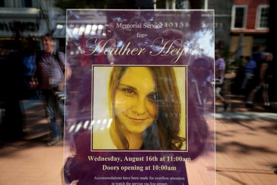 <div class="inline-image__caption"><p>A poster announcing the memorial service for Heather Heyer, who was killed when a car slammed into a crowd of people protesting against a white supremacist rally, stands in the window of the Paramount Theater Aug. 16, 2017 in Charlottesville, Virginia.</p></div> <div class="inline-image__credit">Chip Somodevilla/Getty</div>