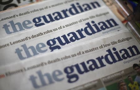 Copies of the Guardian newspaper are displayed at a news agent in London August 21, 2013. REUTERS/Suzanne Plunkett