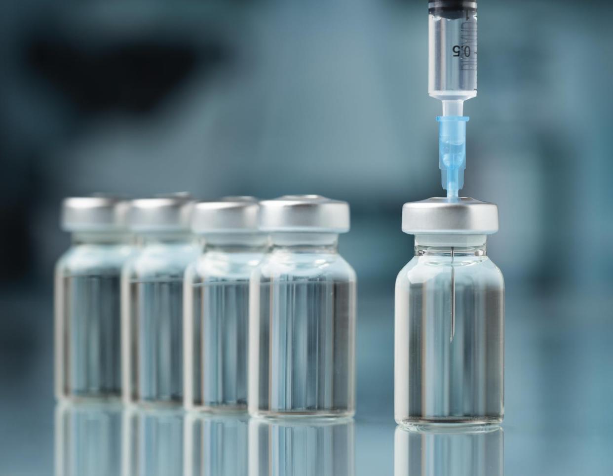 <span class="caption">Viral surveillance and prediction may be key parts of figuring out what goes into a vaccine.</span> <span class="attribution"><a class="link " href="https://www.gettyimages.com/detail/photo/close-up-of-syringe-with-bottles-on-table-pakistan-royalty-free-image/1342313994" rel="nofollow noopener" target="_blank" data-ylk="slk:Pexels Cover/500px via Getty Images;elm:context_link;itc:0;sec:content-canvas">Pexels Cover/500px via Getty Images</a></span>