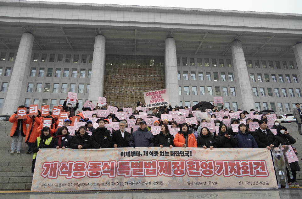 Animal rights activists attend a protest rally supporting the government-led dog meat banning bill at the National Assembly in Seoul, South Korea, Tuesday, Jan. 9, 2024. South Korea's parliament on Tuesday passed a landmark ban on production and sales of dog meat, as public calls for a prohibition have grown sharply over concerns about animal rights and the country's international image.(AP Photo/Ahn Young-joon)