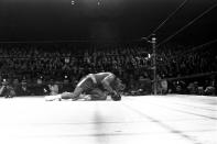 <p>Muhammad Ali is down on the canvas after being floored by Joe Frazier in the 15th round of their heavyweight title fight in New York, March 8, 1971. Frazier won on a decision. (AP Photo)</p> 