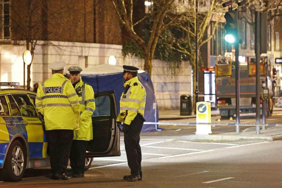 Police at the scene of the crash in Knightsbridge (NIGEL HOWARD)