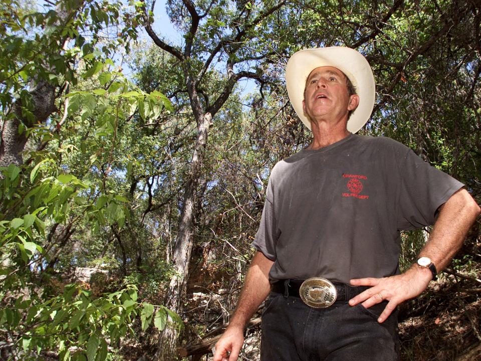 President George W. Bush in a cowboy hat at his ranch in Crawford, Texas.