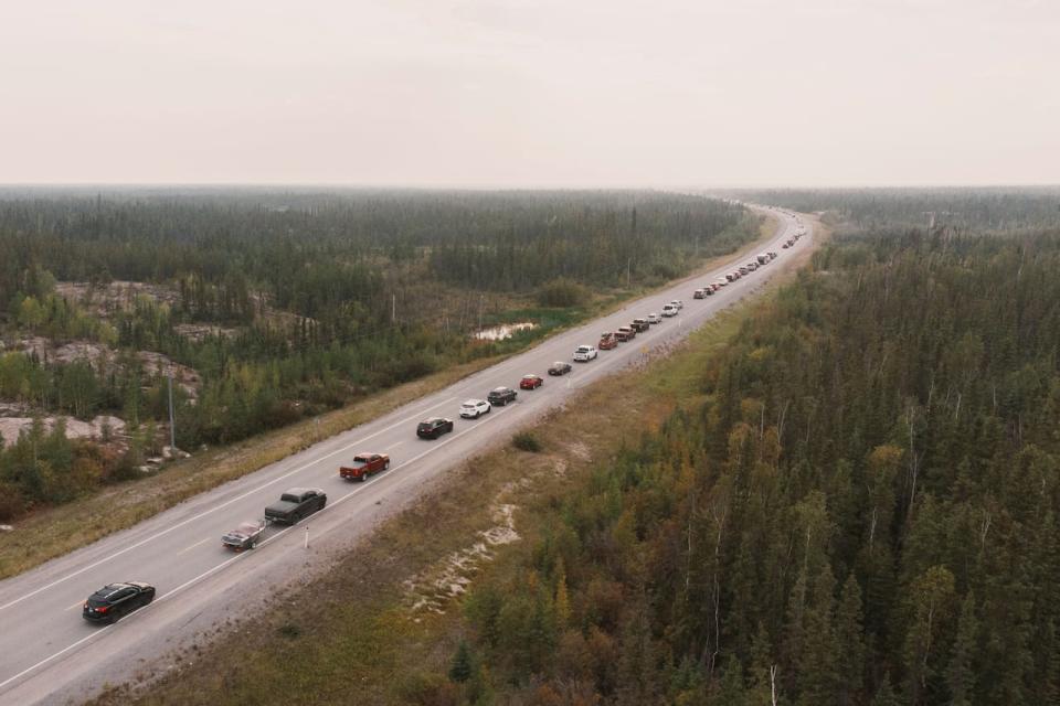 Yellowknife residents leave the city on Highway 3, the only highway in or out of the community, after an evacuation order was given due to the proximity of a wildfire in Yellowknife, Northwest Territories, Canada August 16, 2023.  REUTERS/Pat Kane     TPX IMAGES OF THE DAY