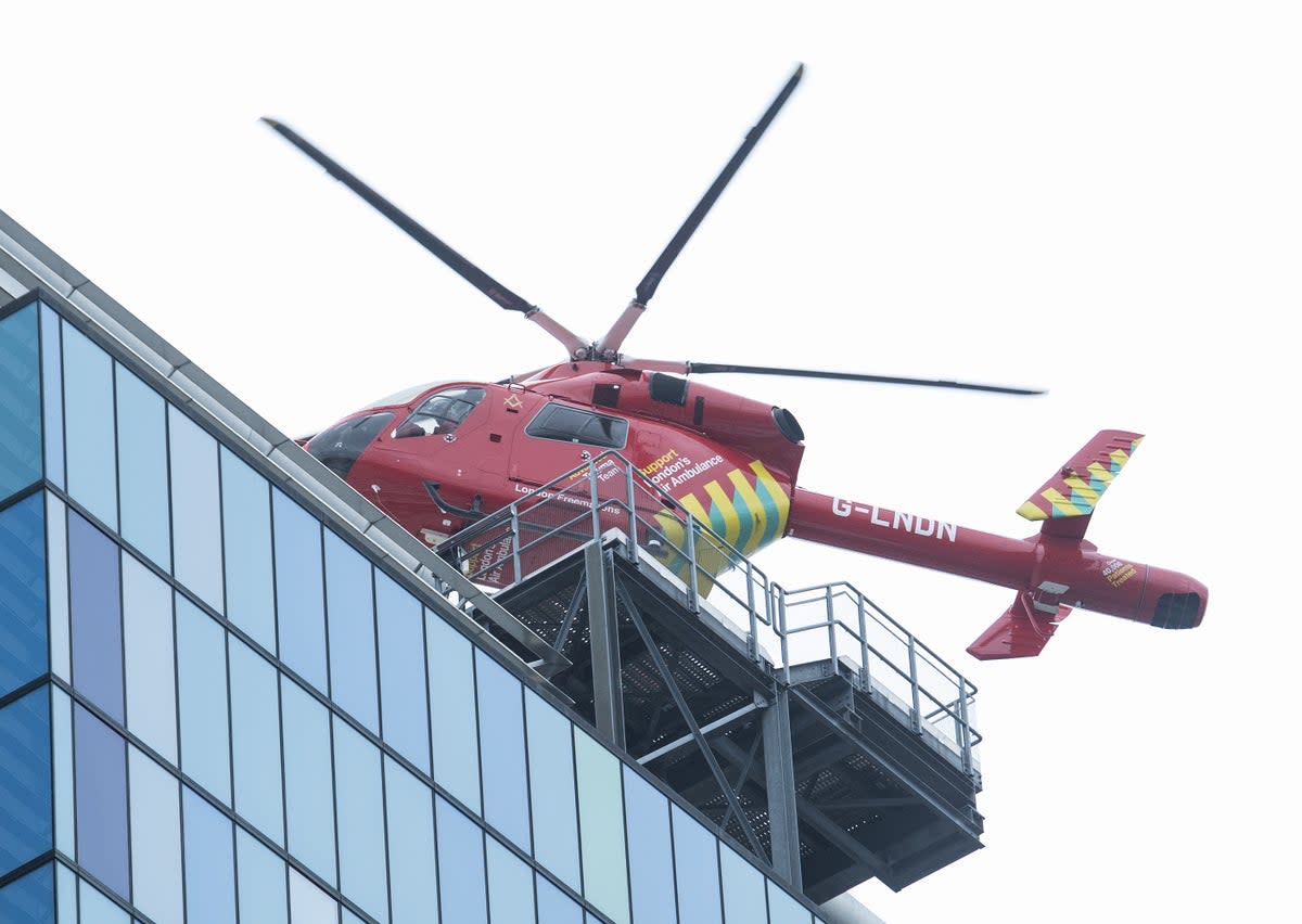 The Air Ambulance lands at the Royal London hospital in London (PA)