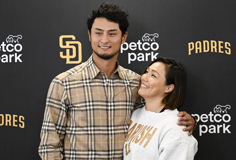 San Diego Padres' Yu Darvish, left, poses for a photo with his wife Seiko Darvish during a baseball news conference, Friday, Feb. 10, 2023, in San Diego. Darvish signed a new contract with the Padres that guarantees the pitcher an additional $90 million and will keep him with the club through the 2028 season. (AP Photo/Denis Poroy)