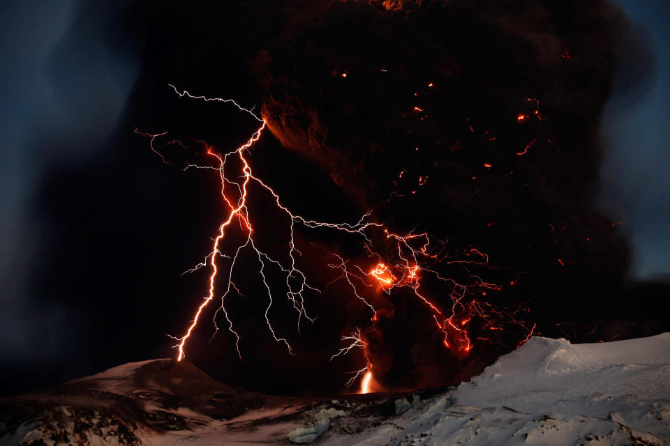 It wasn't the lightning but rather the widespread ash clouds from the April 2010 eruption of Iceland's Eyjafjallajökull volcano (pictured) that eventually grounded a hundred thousand flights. Photograph by Lucas Jackson, Reuters <br><br><a href="http://news.nationalgeographic.com/2012/06/pictures/120611-volcano-lightning-volcanic-redoubt-eos-science/" rel="nofollow noopener" target="_blank" data-ylk="slk:Click here;elm:context_link;itc:0;sec:content-canvas" class="link ">Click here</a> to see more National Geographic photos.