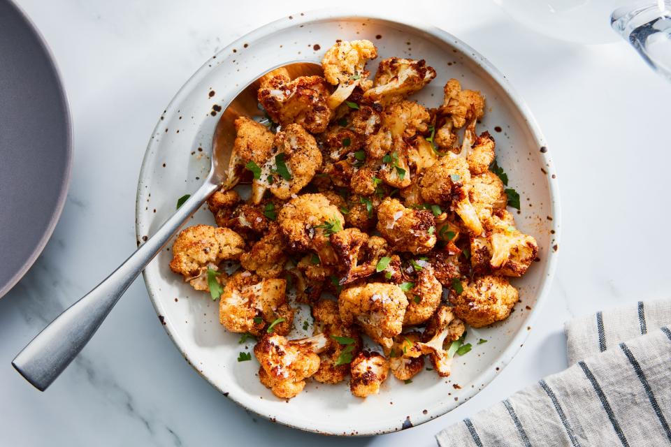 Cauliflower can take a long time to roast; speed things up with the hot air currents of your <a href="https://www.epicurious.com/expert-advice/what-is-the-best-air-fryer-review-article?mbid=synd_yahoo_rss" rel="nofollow noopener" target="_blank" data-ylk="slk:air fryer;elm:context_link;itc:0;sec:content-canvas" class="link ">air fryer</a>. <a href="https://www.epicurious.com/recipes/food/views/air-fryer-cauliflower?mbid=synd_yahoo_rss" rel="nofollow noopener" target="_blank" data-ylk="slk:See recipe.;elm:context_link;itc:0;sec:content-canvas" class="link ">See recipe.</a>