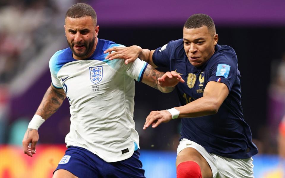 Kyle Walker and Kylian Mbappe running towards the ball