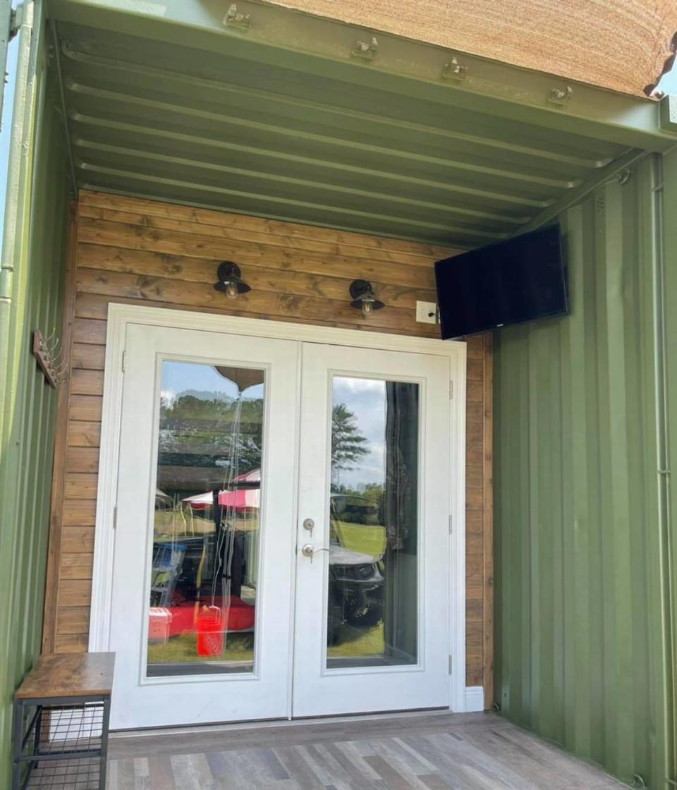 The porch on a 40-foot shipping container modified as a hunting camp.