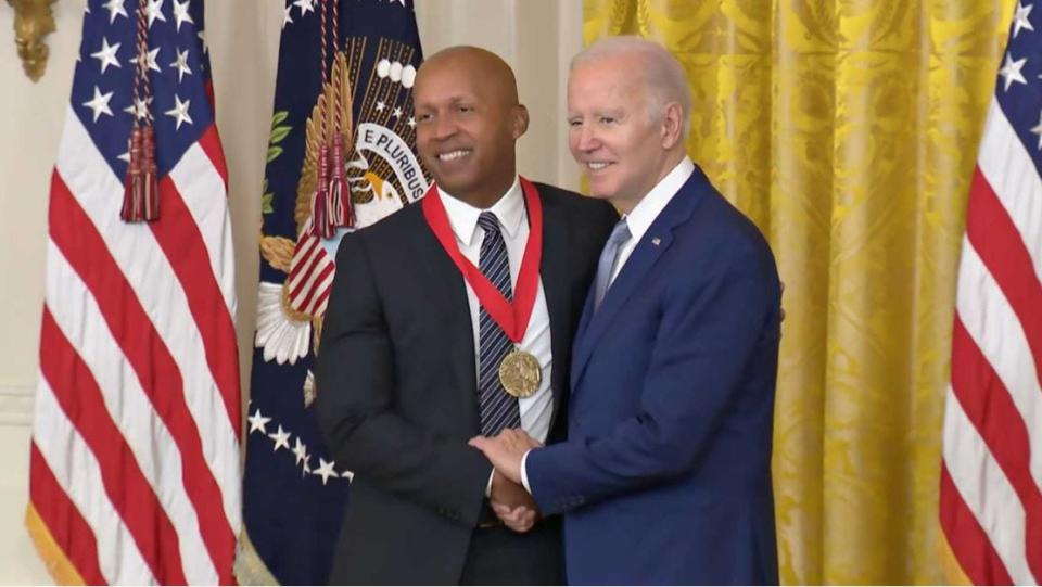 Bryan Stevenson accepts the National Humanities Medal from President Joe Biden on Tuesday, March 21, 2023.