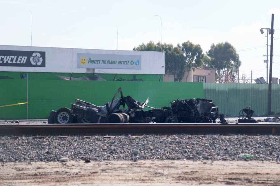 The tractor portion of a big rig is shown on Thursday, Feb. 15, 2024 in the Wilmington section of Los Angeles. Several Los Angeles firefighters were injured, two critically, when an explosion occurred as they responded to a truck with pressurized cylinders that were on fire early Thursday, authorities said. (AP Photo/Eric Thayer)