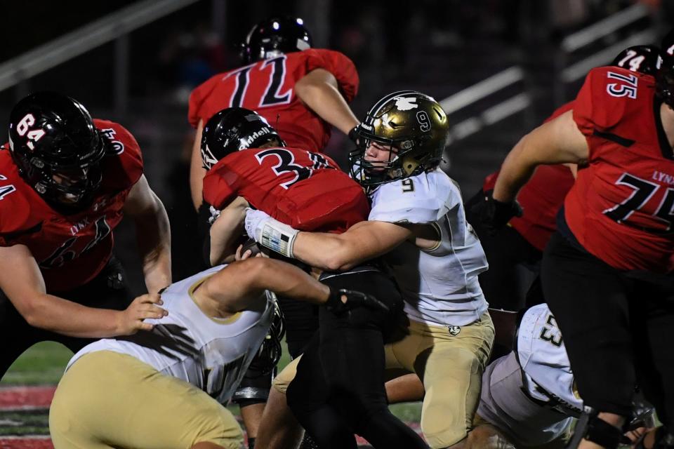 Jefferson's Thomas Heiberger tackles Brandon Valley's Gus Scott on Thursday, Oct. 26, 2023 at Brandon Valley High School in Brandon, South Dakota.